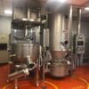 Miscelatori usati in acciaio inox in un laboratorio farmaceutico con area 'EX ZONE'."